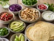 Low calorie chicken tacos with grilled chicken, cabbage, salsa, avocado, cilantro, and lime